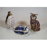 Three Royal Crown Derby desk ornaments to incude Penguin having gold stopper, cat in seated pose,