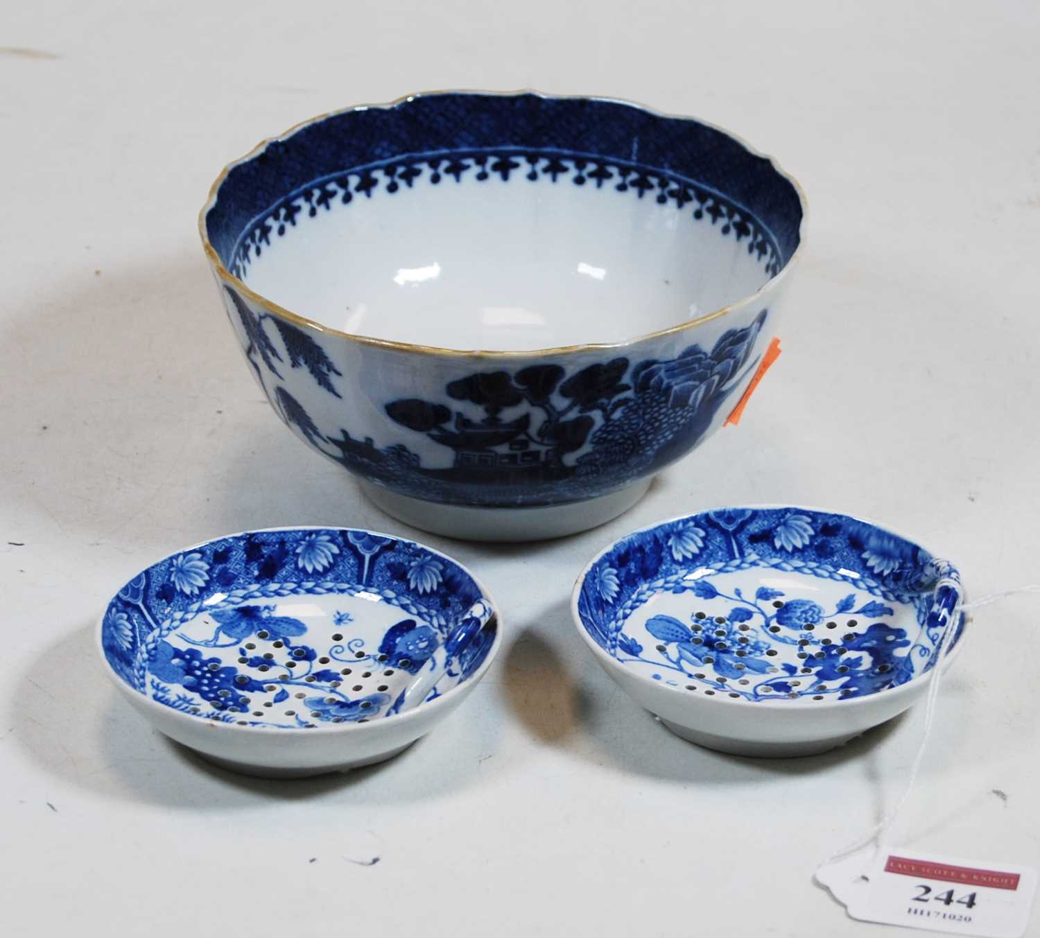 A pair of 19th century blue and white transfer decorated egg strainers, each of circular form with