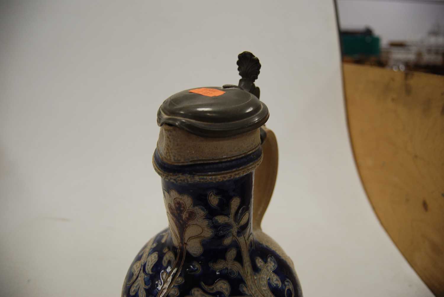 A German Westerwald stoneware jug, with pewter lid and thumb rest decorated in blue with a crucifix, - Image 9 of 14