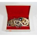 A leather clad jewellery box and contents to include silver bangle, a George V silver and