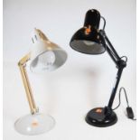 A 20th century black painted metal angle poise desk lamp, together with another similar (2)