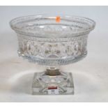 A 20th century crystal pedestal bowl, standing on a faceted stem and square plinth, height 21cm