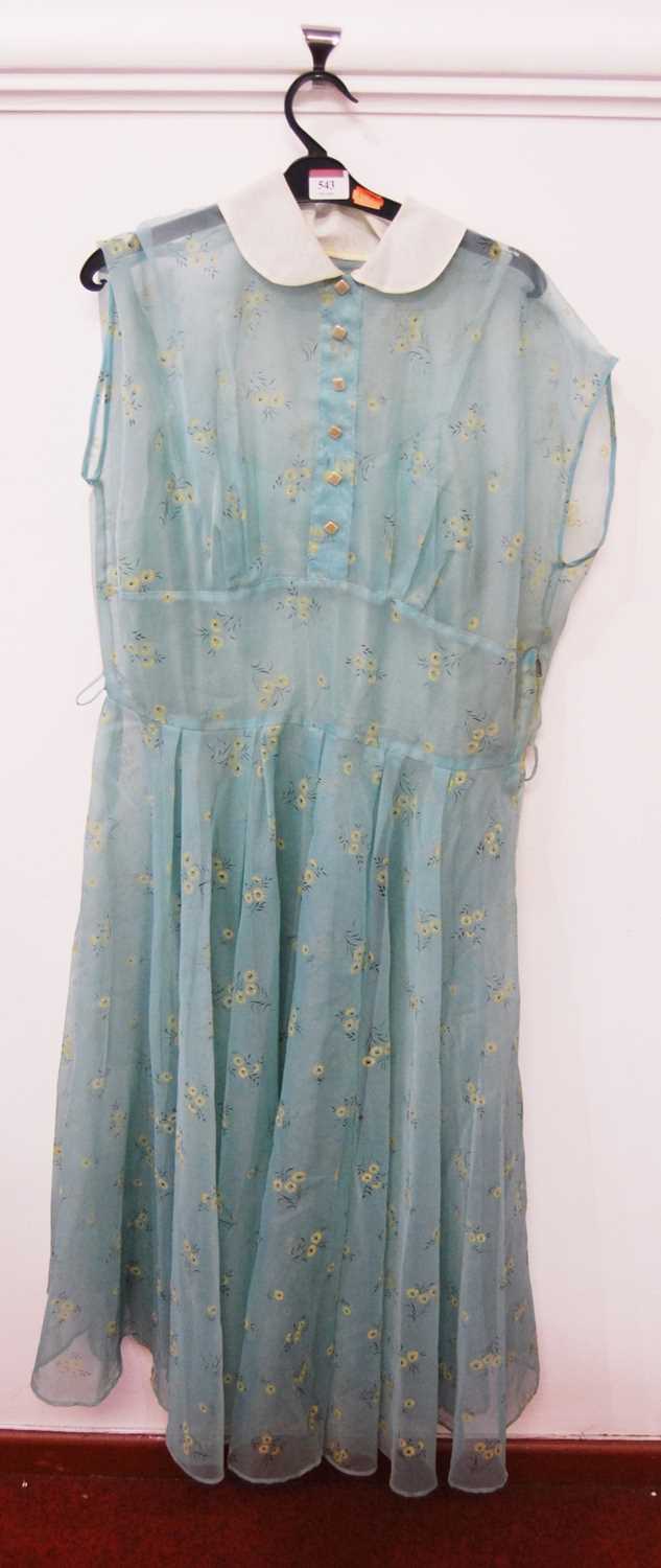 A vintage ladies printed silk three-quarter length dressCondition report: 40cm across the waist.