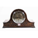 A 1930s walnut cased Nelsons hat mantel clock, the silvered dial showing Arabic numerals, the 8