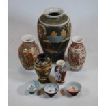 A pair of Japanese Taisho period vases, of baluster form, typically decorated with figures within an