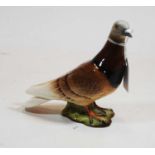 A Beswick figure of a pigeon, model No. 1383 impressed Beswick England mark verso with further