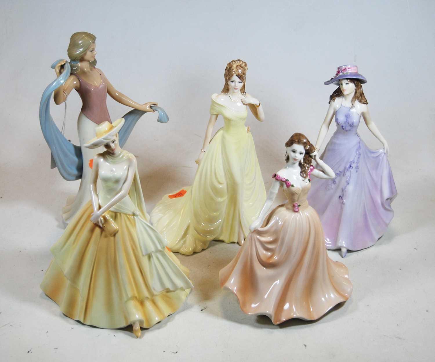 A collection of four Coalport porcelain figures of ladies to include Emma, Susan, Megan, together