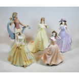 A collection of four Coalport porcelain figures of ladies to include Emma, Susan, Megan, together