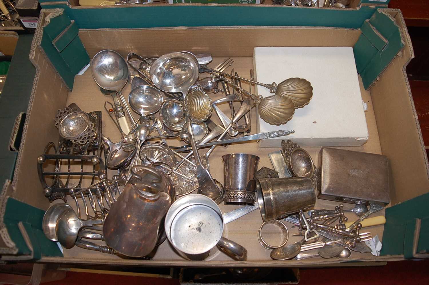 A box of miscellaneous silver plate to include four division toast rack, lawn tennis tournament