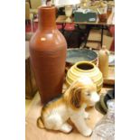 A 20th century ceramic model of a dog, height 36cm, together with two 20th century pottery vases