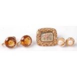 A pair of 9ct gold orange topaz(?) set ear clips, each topaz dia. approx 11mm; together with a