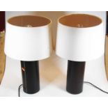 A pair of modern brown leather clad cylindrical table lamps and shades, height 47cm including