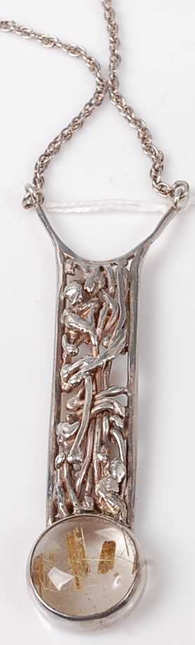 A contemporary Arts & Crafts silver and cabochon crystal(?) set pendant, on finelink neck chain,