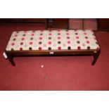 A mahogany framed and upholstered inset low long footstool, length 92cm