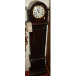 A 1920s oak grand-daughter clock, having enamelled circular dial twin winding holes, h.138cm