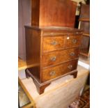 A figured walnut chest of two short over two long drawers, with upper brushing slide, w.66.5cm