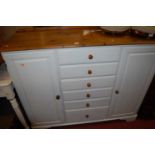 A modern pine part white painted round cornered double door side cupboard, having six central