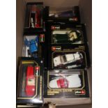 A box containing five Burago boxed 1/18 scale cars, a Maisto Special Edition, and three Burago 1/