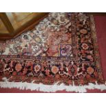 A large Persian woollen cream ground Tabriz rug, 360 x 250cmCondition report: Some fading and