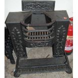 A circa 1900 black painted cast iron fireplace, with near-matching fender (2)Condition report: Width