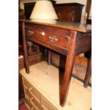 An early 19th century provincial joined oak plank topped single drawer side table, raised on