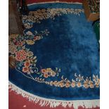 A Chinese Superwash blue ground oval carpet, 280 x 185cm