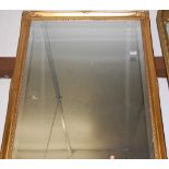 A gilt framed and bevelled rectangular wall mirror 101x69cm