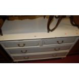 An Edwardian painted walnut(?) low chest of two short over two long drawers, w.117cm