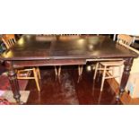 A Victorian mahogany round cornered extending dining table, having a pull-out action and single