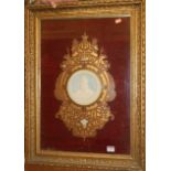An Edwardian commemorative fret carved plaque inset with bisque portrait of Edward VII, the whole in