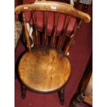 A pair of early 20th century elm and beech stickback pub chairs