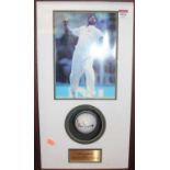 Cricket interest - a cricket ball signed by Muttiah Muralitharan in gazed display case with