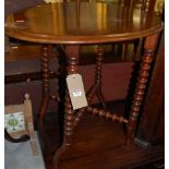 An Edwardian mahogany oval folding occasional table, w.83.5cm