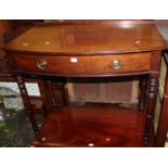 A 19th century mahogany bowfront single drawer side table, raised on ring turned supports, w.91.