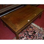 A contemporary Chinese joined elm low rectangular occasional table, having opposing drawers,