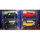 Four 1/16 scale diecast Mini Coopers