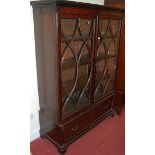 A 19th century mahogany double door glazed bookcase, having single long lower drawer, w.130cm