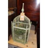 A contemporary green painted wirwork bird-cage