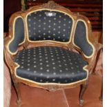 A late 19th century French floral carved walnut framed tub elbow chair, in the Louis XV taste, w.