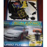 A Scalextric boxed Turbo Flyer set, to include Porsche and Nissan, and a Scalextric Inner City Speed