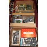 Three boxes of made-up military plastic kits, mainly being tanks