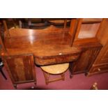 A Regency mahogany ledgeback kneehole sideboard, the bowed single drawer centre flanked by