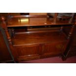 A Victorian mahogany buffet side cupboard, the ball shaped finials over turned columns to twin
