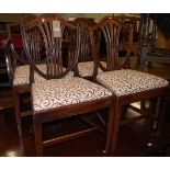 A set of seven 19th century mahogany Heppelwhite style dining chairs, each having re-upholstered