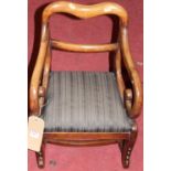 A 19th century childs mahogany balloon back scroll elbow chair (formally a high chair and reduced in