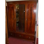 A circa 1900 mahogany, flame mahogany and chequer strung three-door wardrobe, with central