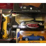 Five boxed modern 1/18 scale diecast cars, to include a Porsche 911 Carrera, Porsche 911 Speedster