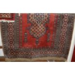 A Persian woollen Tabriz rug, having multiple trailing tramline borders, 170 x 130cm