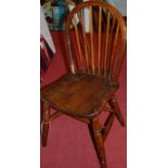 A set of six early 20th century elm seat and beech stickback kitchen chairs