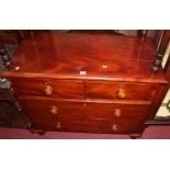 A Victorian mahogany low chest of two short over two long drawers with turned knob handles, on